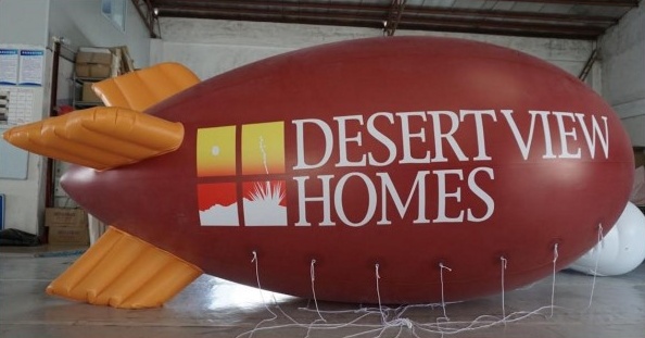 Red Advertising Desert View Homes Blimp