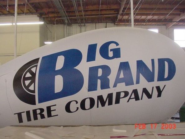 White Blue Advertising Big Brand Tire Company Blimp