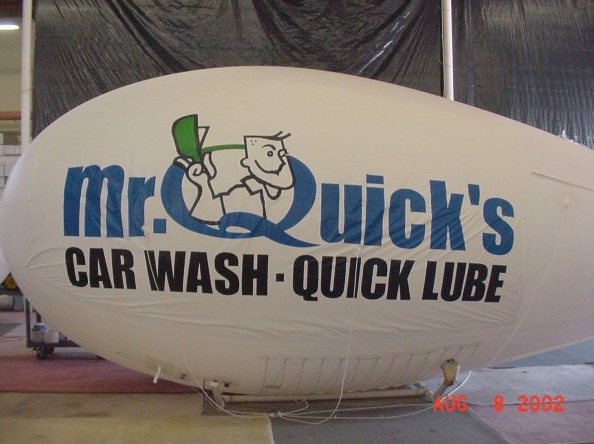White Blue Advertising Quicks Car Wash Quick Lube Blimp