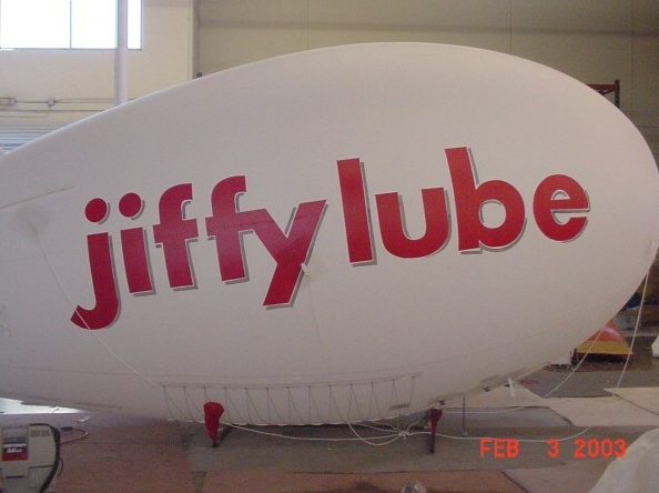 White Red Advertising Jiffy Lube Blimp
