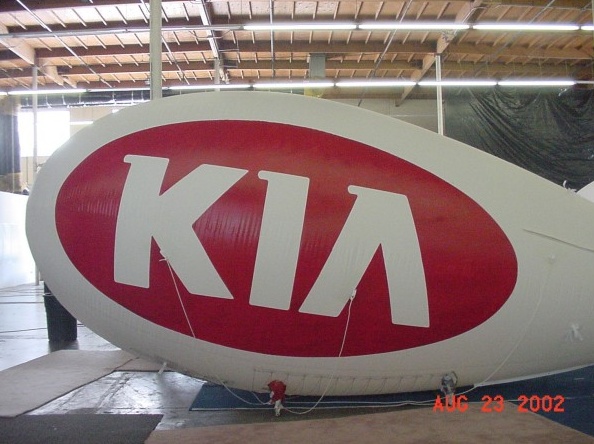 White Red Advertising Kia Blimp