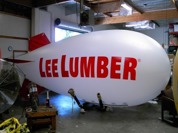 White Red Advertising Lee Lumber Blimp