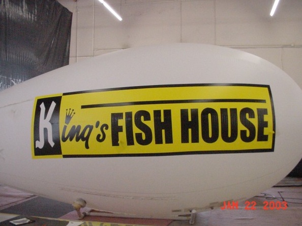 White Yellow Advertising Kings Fish House Blimp