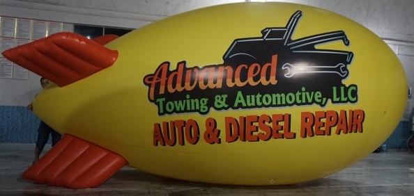 Yellow Red Advertising Advanced Towing Automotive Blimp